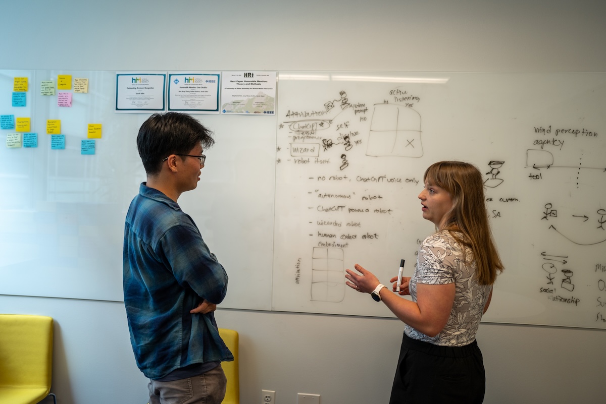 Research discussion in PI Sarah Sebo's office